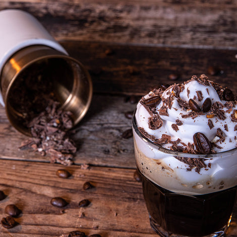 Coffee with whipped cream and Tony’s Chocolonely flakes