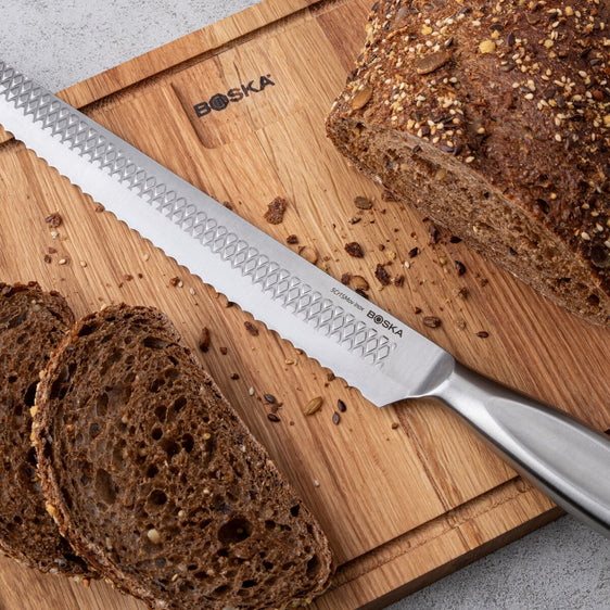 Bread knife on a wooden board