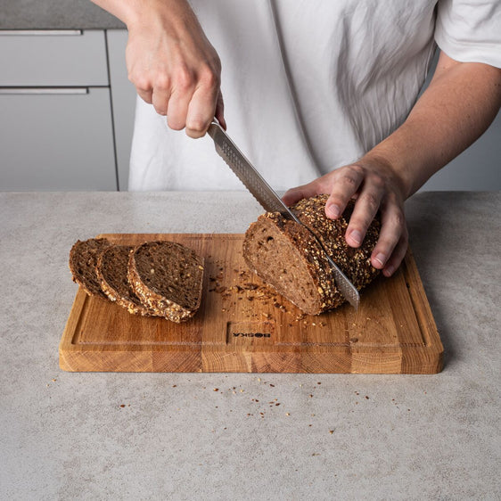 Bread being cut by bread knife